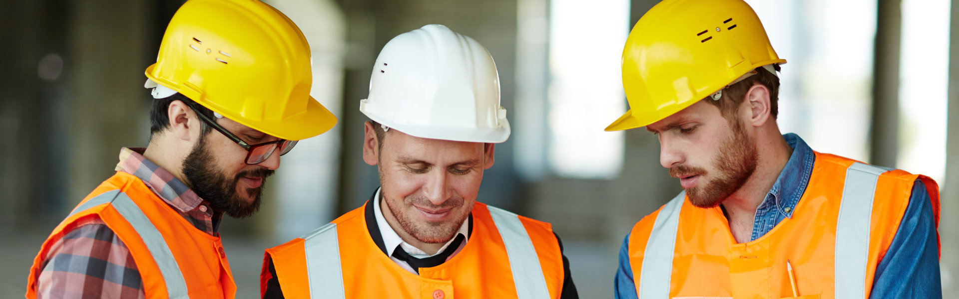 workers wearing protective helmets and vest